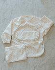 Micasso & Co Bavette à manches longues 6-24 mois avec pochette intégrée qui attrape la nourriture 6-24 mois Alimentation Micasso & Co Chalet